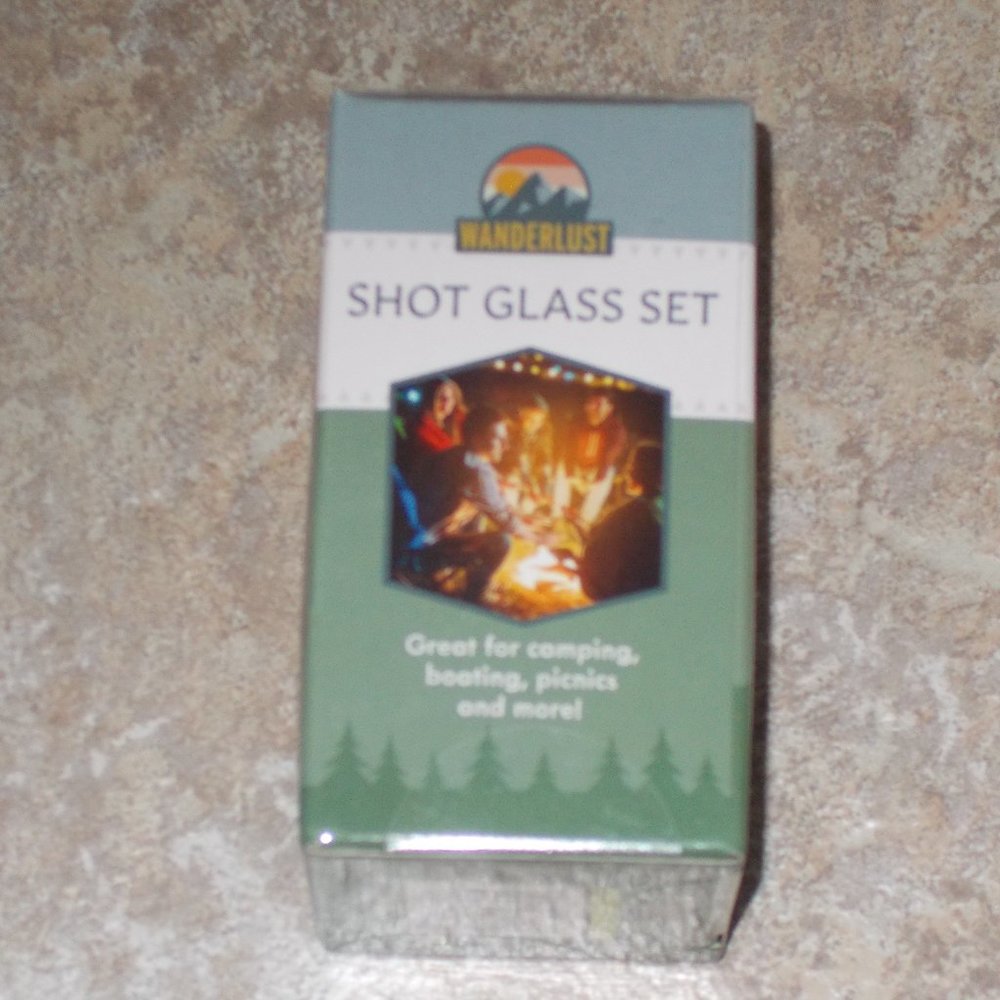 NIB four novelty 1 oz stainless steel shot glasses with custom case